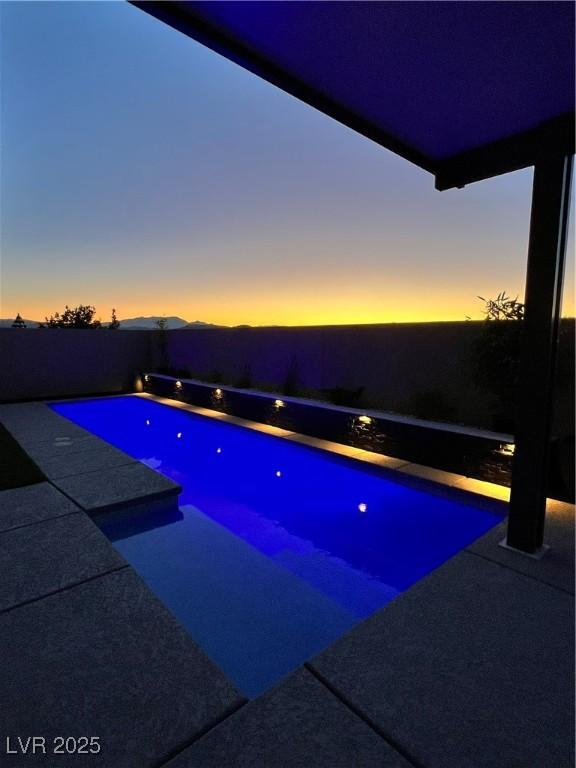 3244 Timorasso Ave, Henderson, NV 89044 - pool at dusk featuring a patio