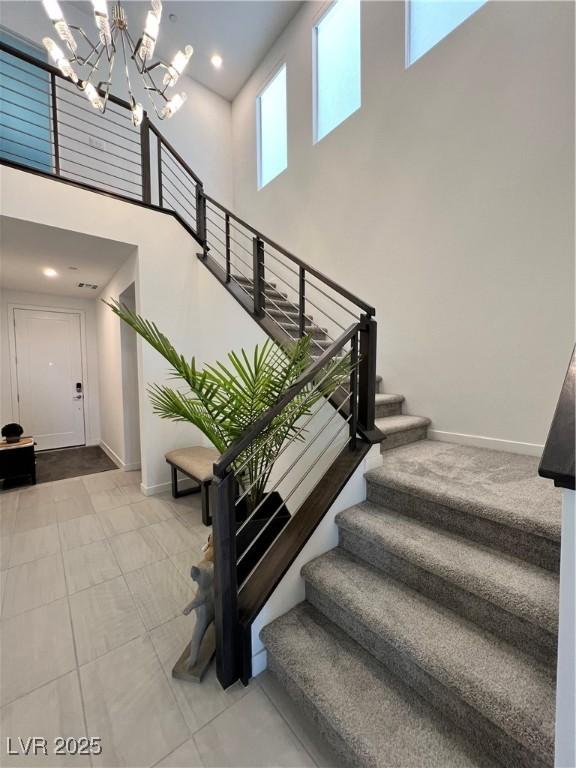 3244 Timorasso Ave, Henderson, NV 89044 - staircase with a towering ceiling and a chandelier