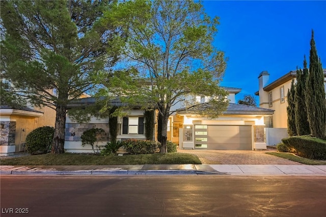 516 Pinnacle Heights Ln, Las Vegas, NV 89144 - view of front of house with driveway, a garage, and stucco siding