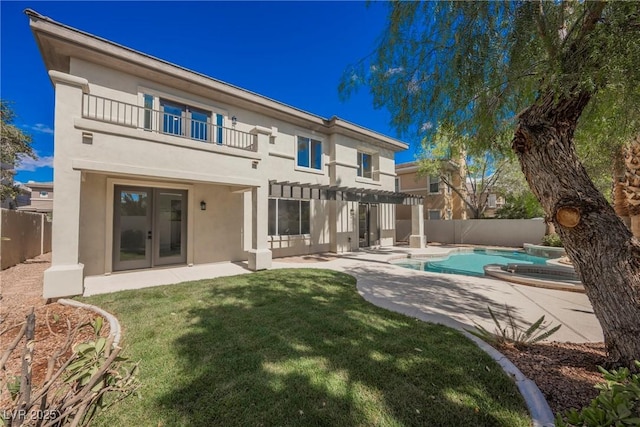 516 Pinnacle Heights Ln, Las Vegas, NV 89144 - rear view of house with a balcony, french doors, a pergola, stucco siding, and a fenced backyard