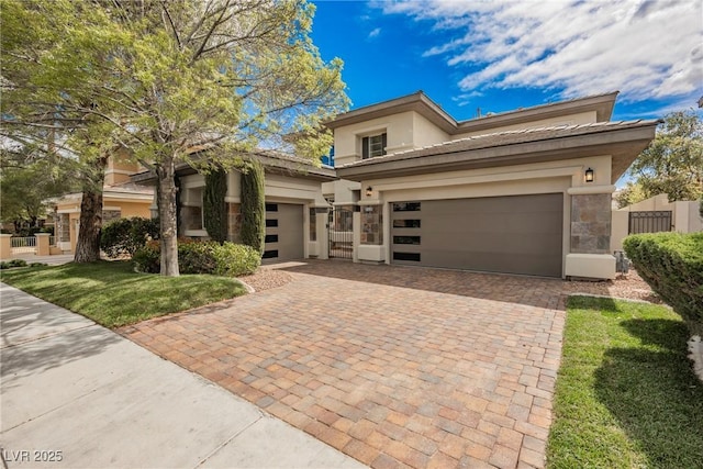 516 Pinnacle Heights Ln, Las Vegas, NV 89144 - prairie-style house featuring decorative driveway, stucco siding, a tiled roof, a garage, and a front yard