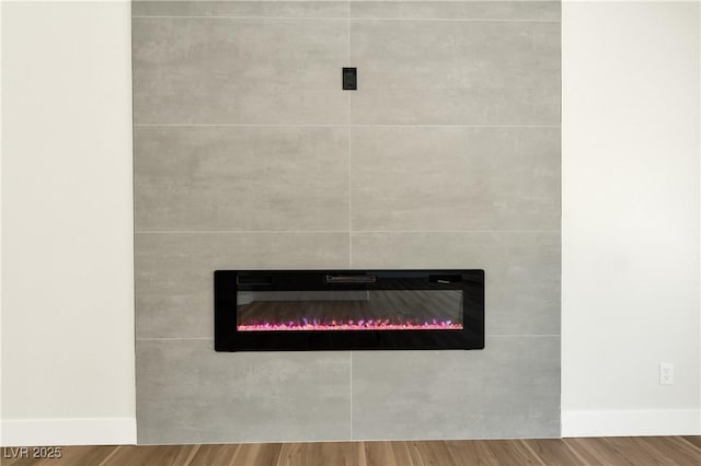 9349 Lakefront Color St, Las Vegas, NV 89178 - detailed view of a tiled fireplace and wood finished floors