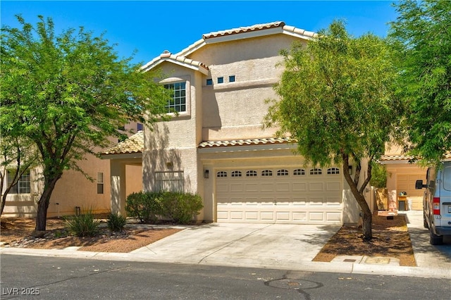 9349 Lakefront Color St, Las Vegas, NV 89178 - mediterranean / spanish-style home featuring a tile roof, stucco siding, concrete driveway, and an attached garage