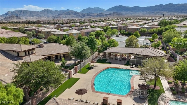 10645 Mount Jefferson Ave, Las Vegas, NV 89166 - aerial perspective of suburban area featuring a pool area and mountains