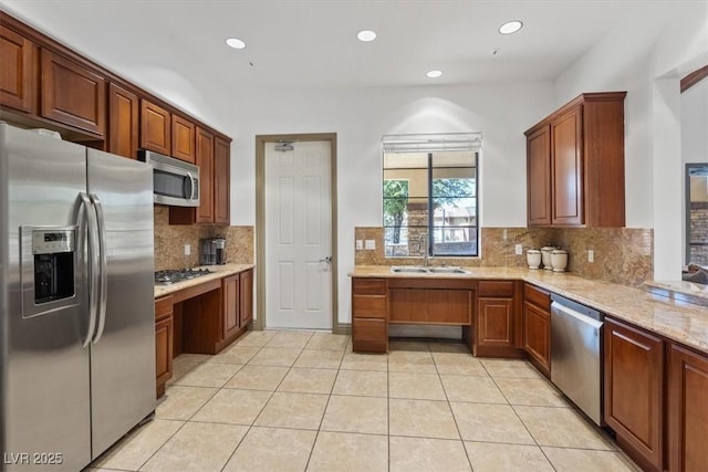 10645 Mount Jefferson Ave, Las Vegas, NV 89166 - kitchen featuring appliances with stainless steel finishes, tasteful backsplash, light tile patterned floors, recessed lighting, and light stone counters
