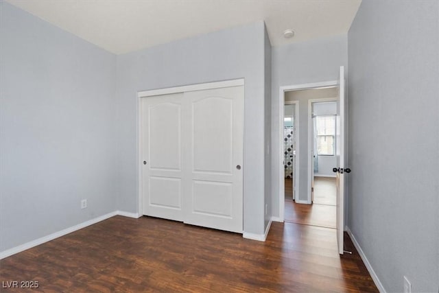 10645 Mount Jefferson Ave, Las Vegas, NV 89166 - unfurnished bedroom featuring dark wood-style flooring and a closet