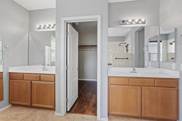 10645 Mount Jefferson Ave, Las Vegas, NV 89166 - full bathroom featuring a tile shower, two vanities, tile patterned floors, and a spacious closet