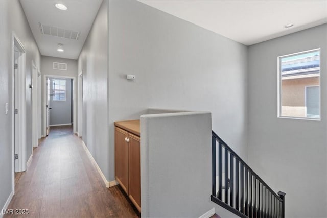 10645 Mount Jefferson Ave, Las Vegas, NV 89166 - hallway with an upstairs landing, dark wood-style floors, and recessed lighting