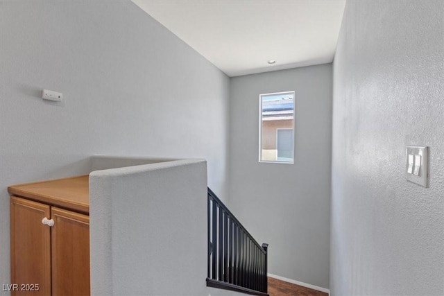 10645 Mount Jefferson Ave, Las Vegas, NV 89166 - hallway with an upstairs landing and baseboards
