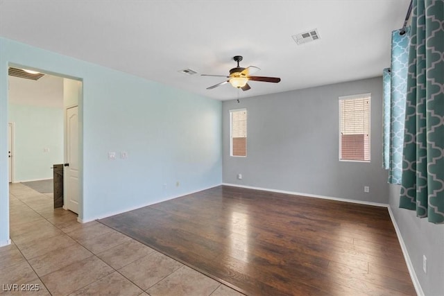 10645 Mount Jefferson Ave, Las Vegas, NV 89166 - empty room with ceiling fan, plenty of natural light, and tile patterned floors
