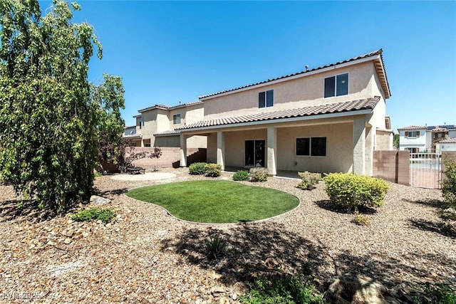 3613 Rubio Sun Ave, North Las Vegas, NV 89081 - rear view of property with stucco siding and a tile roof