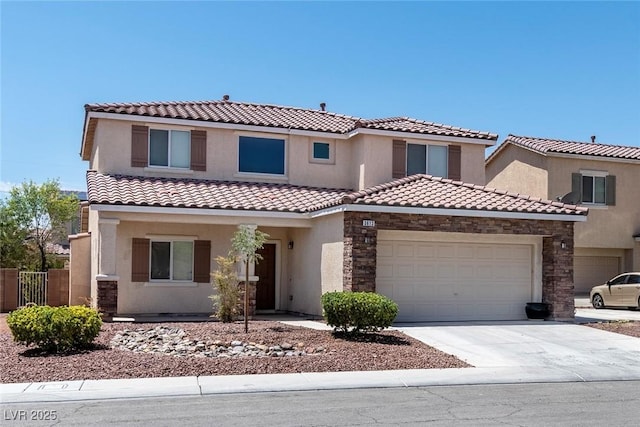 3613 Rubio Sun Ave, North Las Vegas, NV 89081 - mediterranean / spanish house with a garage, concrete driveway, a tiled roof, stone siding, and stucco siding