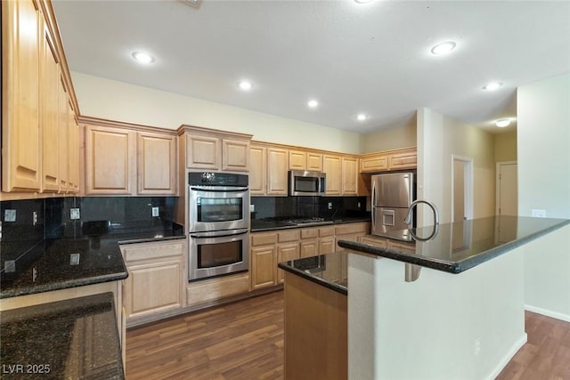 3613 Rubio Sun Ave, North Las Vegas, NV 89081 - kitchen featuring stainless steel appliances, light brown cabinets, dark wood-type flooring, tasteful backsplash, and recessed lighting