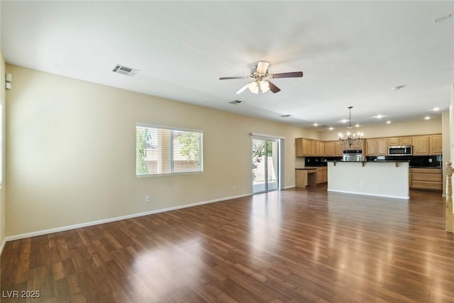 3613 Rubio Sun Ave, North Las Vegas, NV 89081 - unfurnished living room with a chandelier, a ceiling fan, and dark wood-style floors
