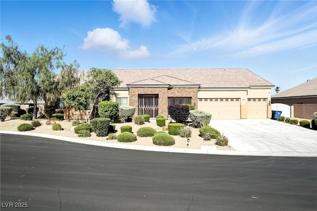 7330 Silent Water Way, Las Vegas, NV 89149 - view of front of home featuring a garage, driveway, and stucco siding