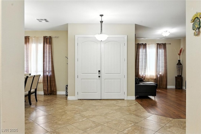 7330 Silent Water Way, Las Vegas, NV 89149 - entrance foyer with light tile patterned flooring and baseboards