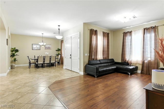 7330 Silent Water Way, Las Vegas, NV 89149 - living area with a chandelier and light tile patterned flooring