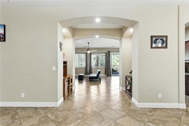 7330 Silent Water Way, Las Vegas, NV 89149 - hall with arched walkways and light tile patterned flooring