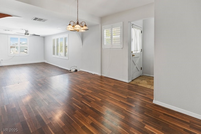 7221 Alta Dr, Las Vegas, NV 89145 - unfurnished living room featuring wood finished floors, a ceiling fan, and a chandelier
