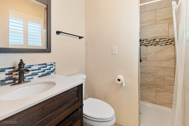 7221 Alta Dr, Las Vegas, NV 89145 - bathroom with vanity, a tile shower, and tasteful backsplash