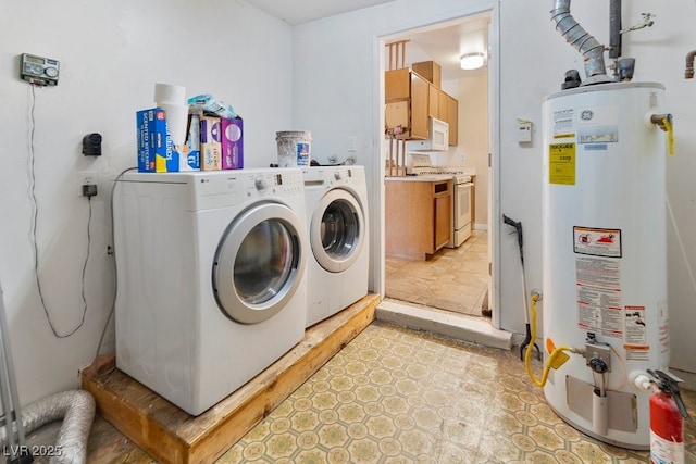 7221 Alta Dr, Las Vegas, NV 89145 - laundry area featuring gas water heater and washer and clothes dryer