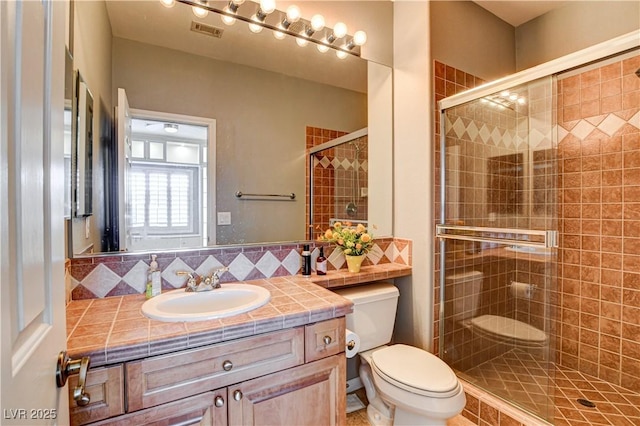 109 N Buteo Woods Ln, Las Vegas, NV 89144 - full bath featuring vanity, a stall shower, and decorative backsplash