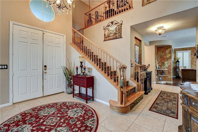 109 N Buteo Woods Ln, Las Vegas, NV 89144 - entrance foyer with stairway, tile patterned floors, a chandelier, and a high ceiling