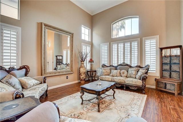 109 N Buteo Woods Ln, Las Vegas, NV 89144 - living room with crown molding, wood finished floors, and a towering ceiling