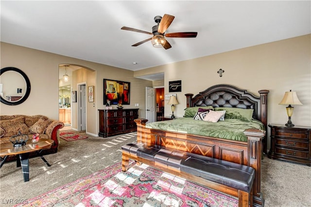 109 N Buteo Woods Ln, Las Vegas, NV 89144 - bedroom featuring carpet, arched walkways, ensuite bathroom, and a ceiling fan