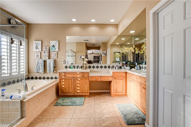 109 N Buteo Woods Ln, Las Vegas, NV 89144 - bathroom featuring a bath, vanity, tile patterned flooring, a shower with shower door, and recessed lighting