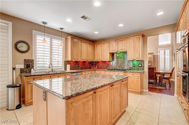 109 N Buteo Woods Ln, Las Vegas, NV 89144 - kitchen featuring light tile patterned floors, a kitchen island, light stone counters, and recessed lighting
