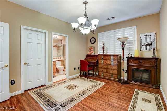 109 N Buteo Woods Ln, Las Vegas, NV 89144 - sitting room featuring a chandelier and wood finished floors