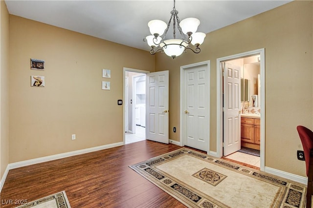 109 N Buteo Woods Ln, Las Vegas, NV 89144 - entryway featuring a chandelier and light wood-style floors