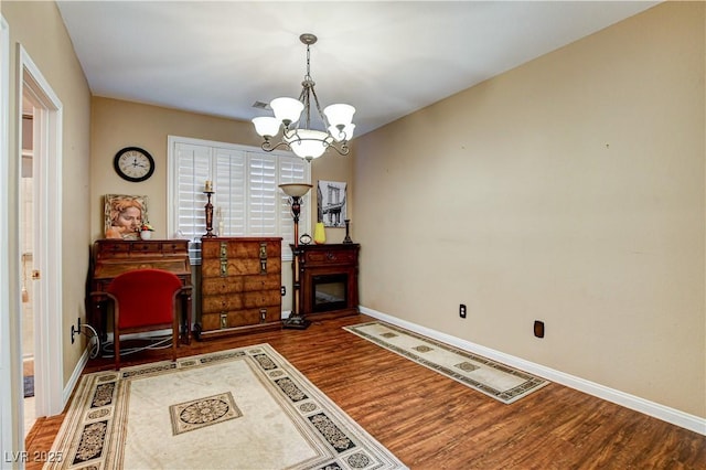 109 N Buteo Woods Ln, Las Vegas, NV 89144 - sitting room with wood finished floors and a chandelier