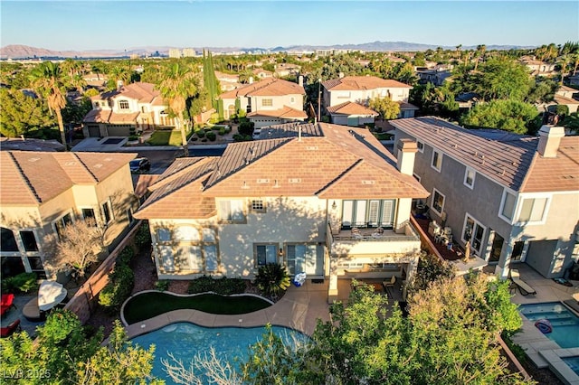 109 N Buteo Woods Ln, Las Vegas, NV 89144 - aerial perspective of suburban area with a mountainous background