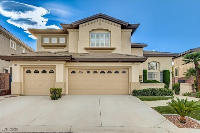 109 N Buteo Woods Ln, Las Vegas, NV 89144 - view of front of property featuring concrete driveway, a garage, and stucco siding