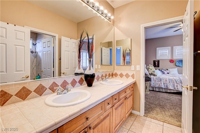 109 N Buteo Woods Ln, Las Vegas, NV 89144 - bathroom with double vanity, tile patterned flooring, connected bathroom, a shower, and backsplash