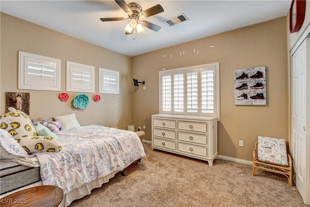 109 N Buteo Woods Ln, Las Vegas, NV 89144 - bedroom with a closet, light colored carpet, and a ceiling fan