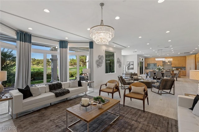 1613 Iron Ridge Dr, Las Vegas, NV 89117 - living room with recessed lighting, healthy amount of natural light, a chandelier, and light wood-style flooring