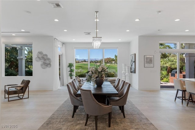 1613 Iron Ridge Dr, Las Vegas, NV 89117 - dining space with recessed lighting, light wood-style flooring, and a chandelier