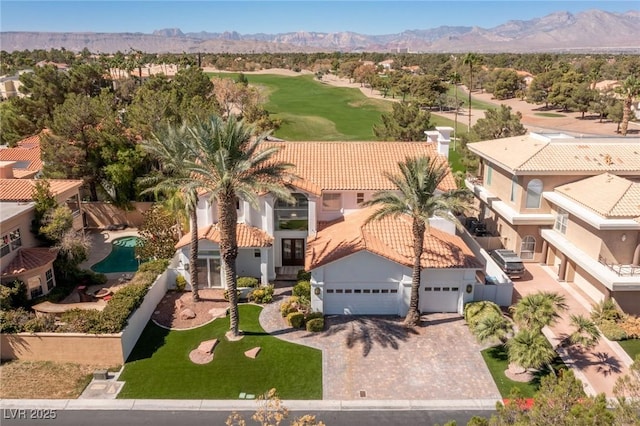 1613 Iron Ridge Dr, Las Vegas, NV 89117 - aerial perspective of suburban area with a mountainous background and a golf club