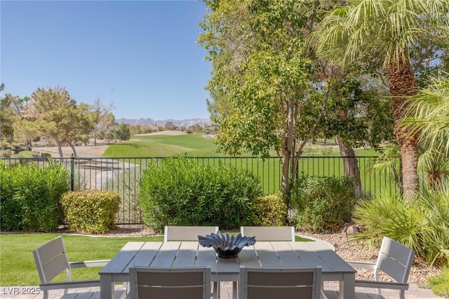 1613 Iron Ridge Dr, Las Vegas, NV 89117 - view of patio / terrace featuring outdoor dining space, a mountain view, and view of golf course