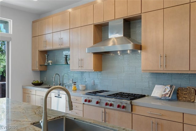1613 Iron Ridge Dr, Las Vegas, NV 89117 - kitchen with wall chimney range hood, stainless steel gas stovetop, light brown cabinets, and tasteful backsplash