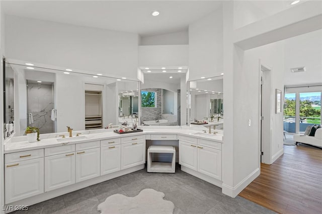 1613 Iron Ridge Dr, Las Vegas, NV 89117 - full bath with recessed lighting, vanity, a shower stall, ensuite bath, and high vaulted ceiling