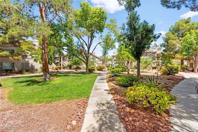 5710 E Tropicana Ave Unit 1035, Las Vegas, NV 89122 - view of home's community with a residential view and a lawn