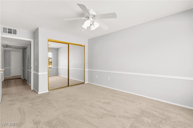 5710 E Tropicana Ave Unit 1035, Las Vegas, NV 89122 - unfurnished bedroom featuring carpet, a closet, and a ceiling fan