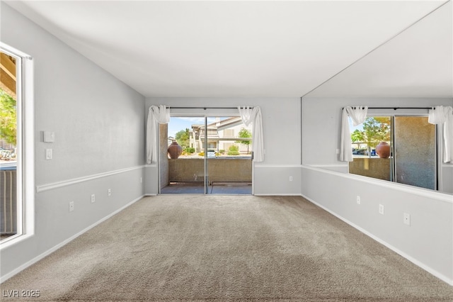 5710 E Tropicana Ave Unit 1035, Las Vegas, NV 89122 - carpeted empty room with plenty of natural light