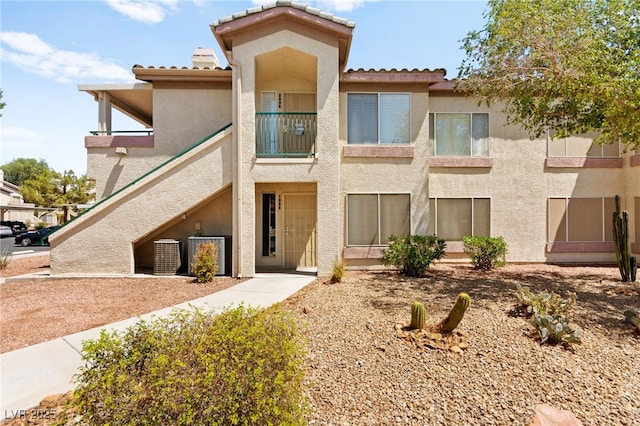 5710 E Tropicana Ave Unit 1035, Las Vegas, NV 89122 - view of front of home featuring stucco siding and a tile roof