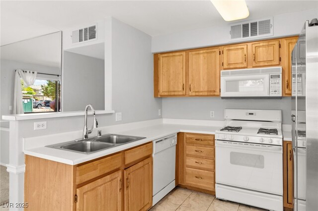 5710 E Tropicana Ave Unit 1035, Las Vegas, NV 89122 - kitchen with white appliances, light countertops, and a peninsula