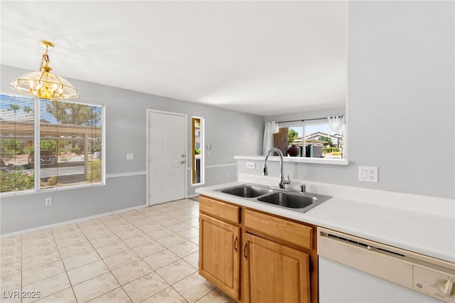 5710 E Tropicana Ave Unit 1035, Las Vegas, NV 89122 - kitchen featuring white dishwasher, light countertops, a chandelier, pendant lighting, and light tile patterned floors